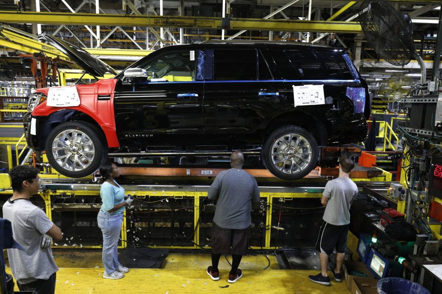 Workers assemble a Ford Expedition