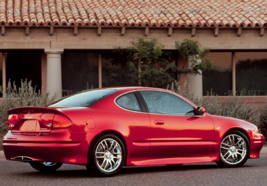The rear 3/4 view of the red Oldsmobile Alero OSV