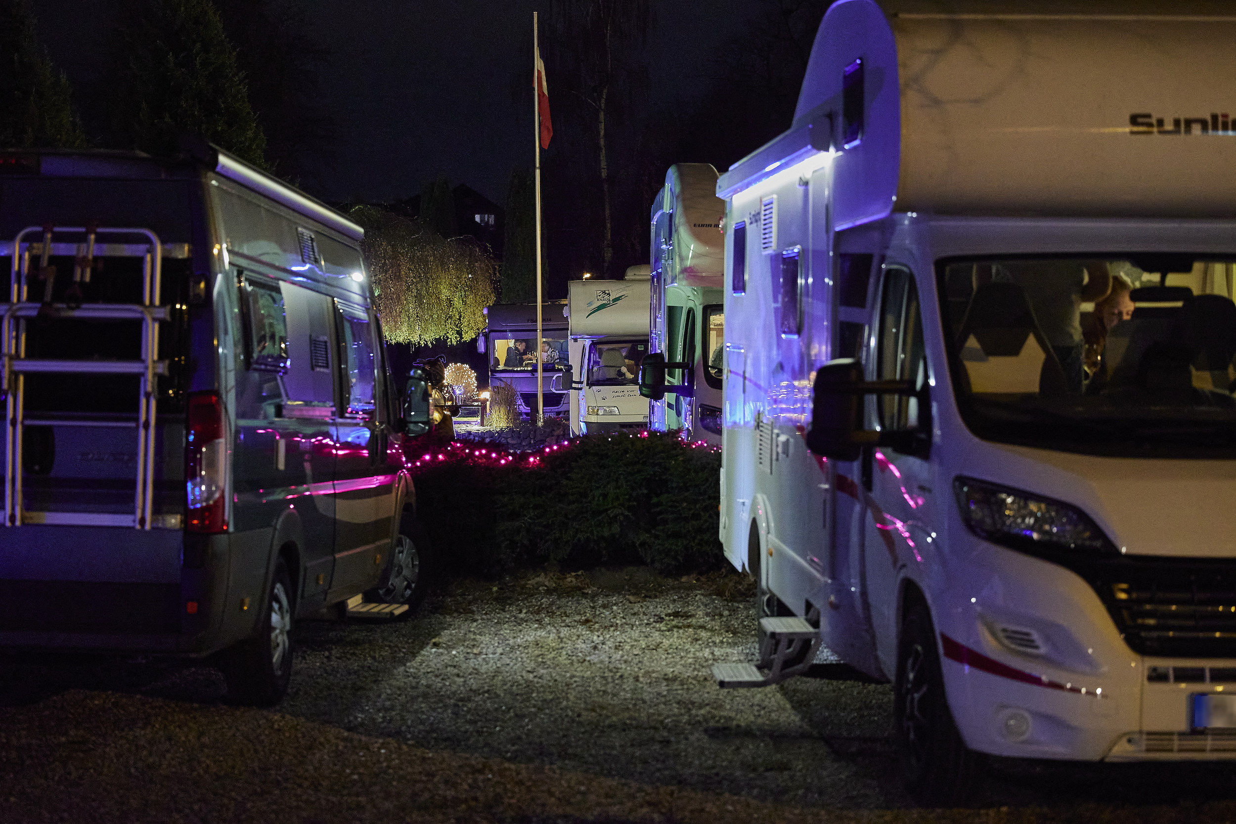 Parked Recreational vehicles (RV) are seen in the parking lot of the Kochschule Neumuenster cooking school