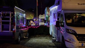 Parked Recreational vehicles (RV) are seen in the parking lot of the Kochschule Neumuenster cooking school
