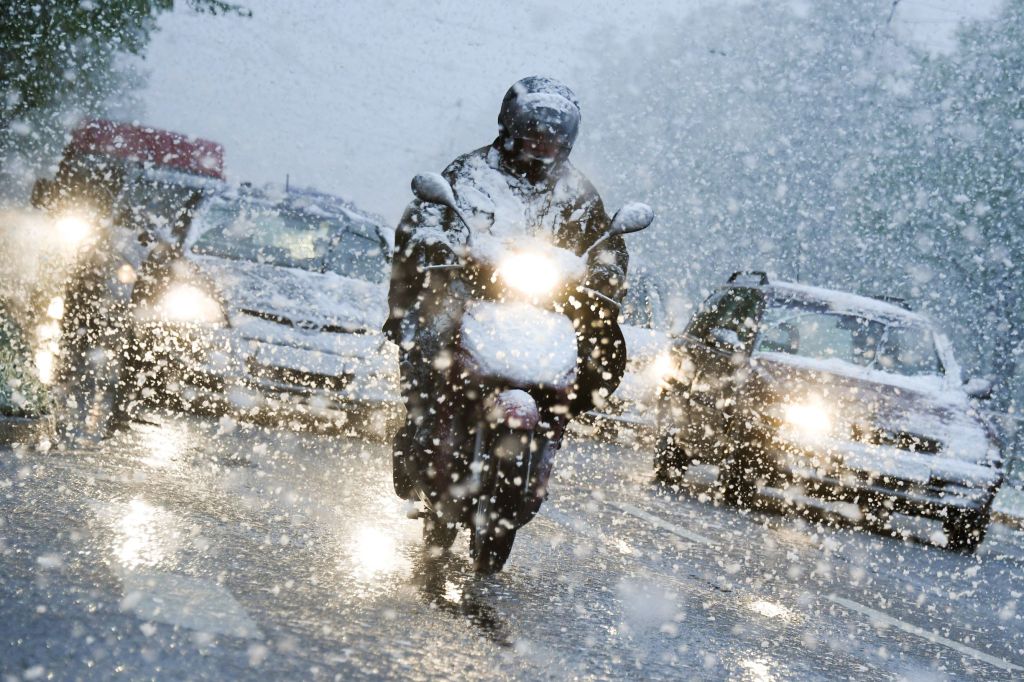 Riding a motorcycle through a winter snowstorm