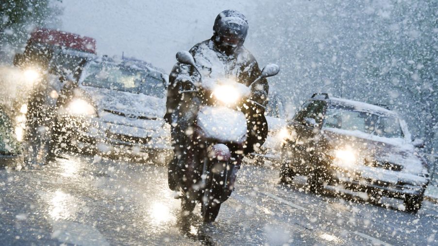 Riding a motorcycle through a winter snowstorm