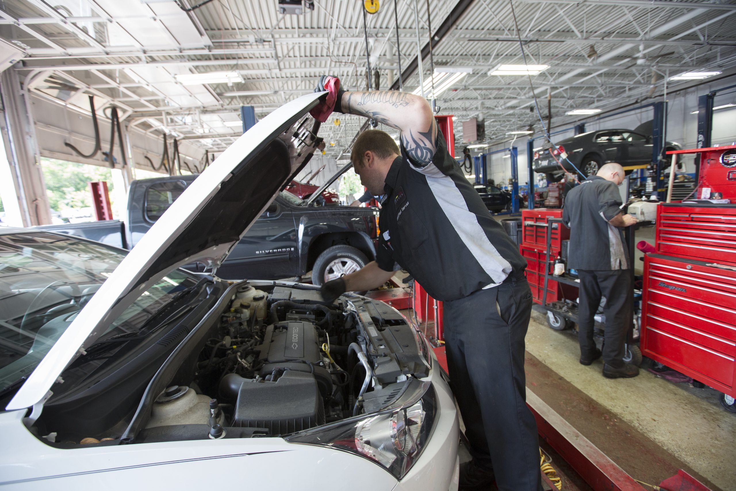 Technician Danny Hardy works on a car at Chevrolet for recall service