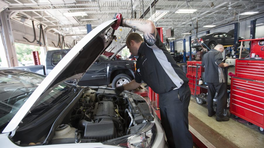 Technician Danny Hardy works on a car at Chevrolet for recall service