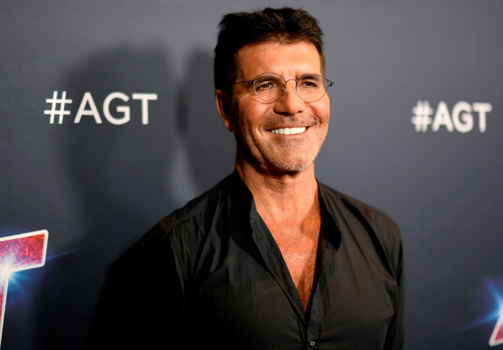 Simon Cowell smiles for a photo opportunity. 