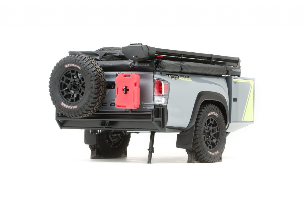 The rear of the TRD-Sport Trailer from Toyota has a swing away bumper with a spare tire and gas can attached. 