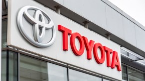 Toyota company logo seen on one of their car dealerships showrooms in London