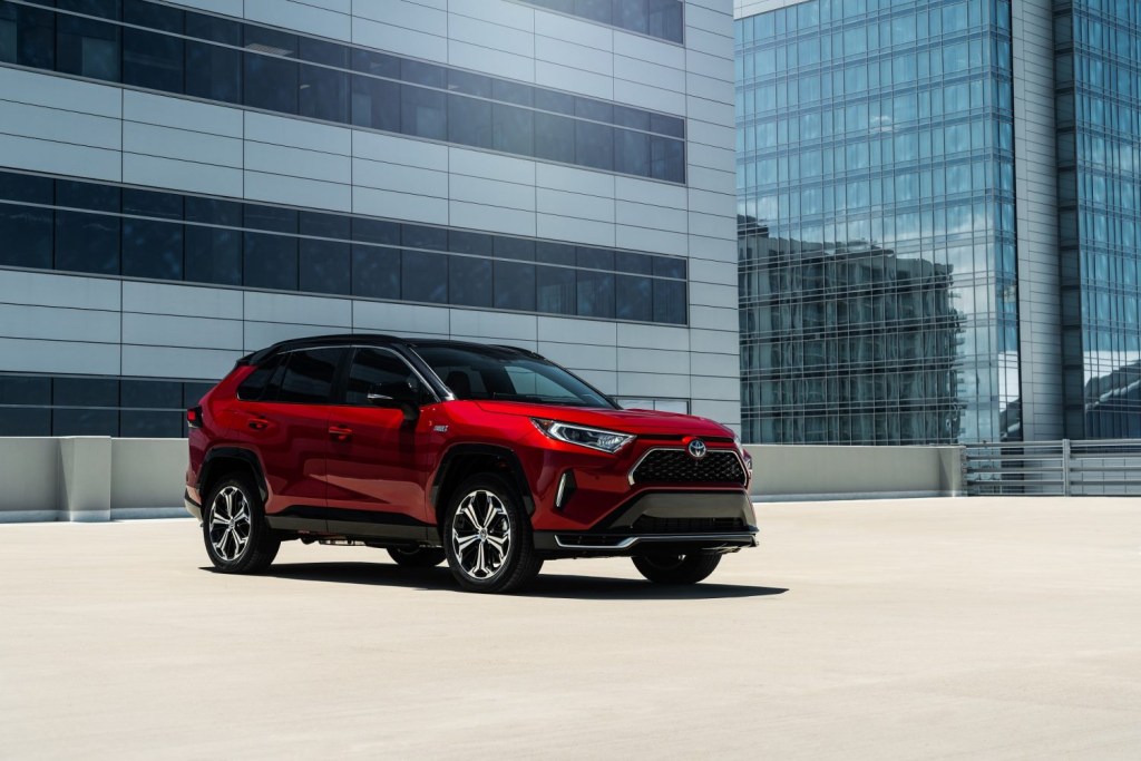 An image of the 2021 Toyota RAV4 Prime parked on the top of a building.