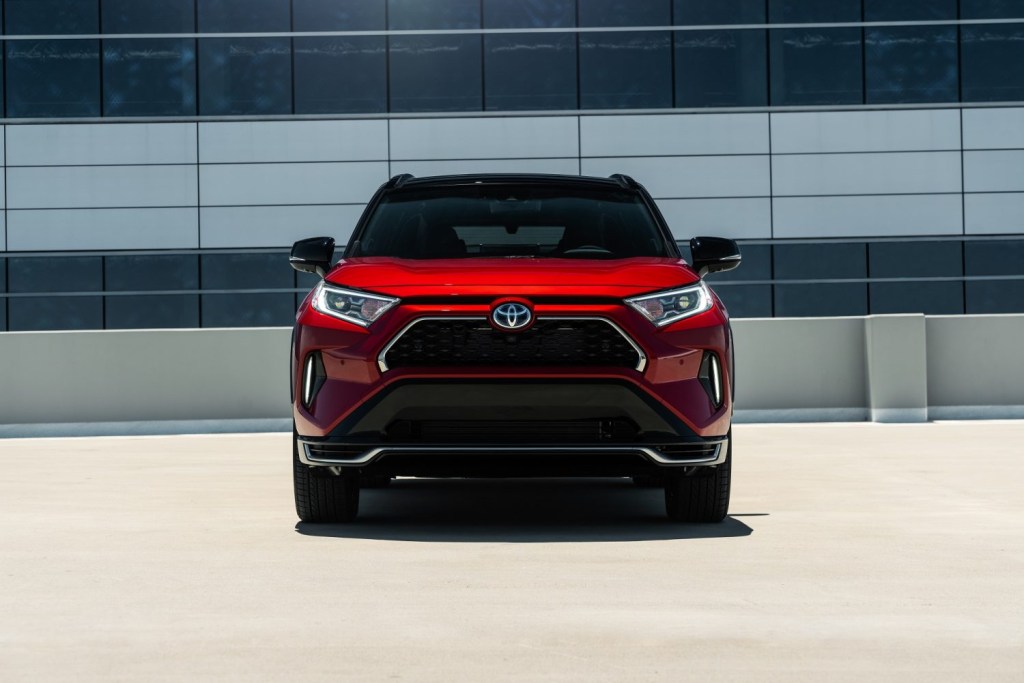 An image of the 2021 Toyota RAV4 Prime parked on the top of a building.