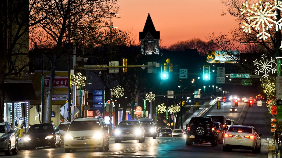 Cars driving at night on the 300 block of Penn Street looking West toward the Penn Street Bridge on December 10, 2020, in Reading, Pennsylvania