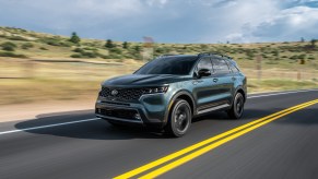 An image of a 2021 Kia Sorento driving down the road.