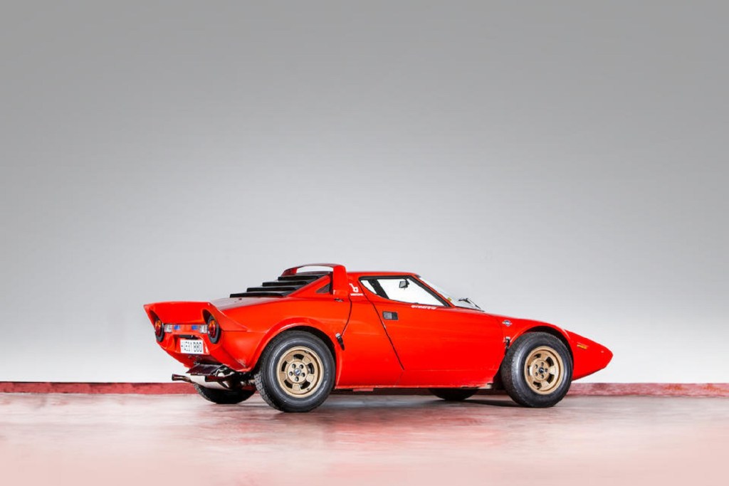 The rear 3/4 view of a red 1974 Lancia Stratos HF Stradale