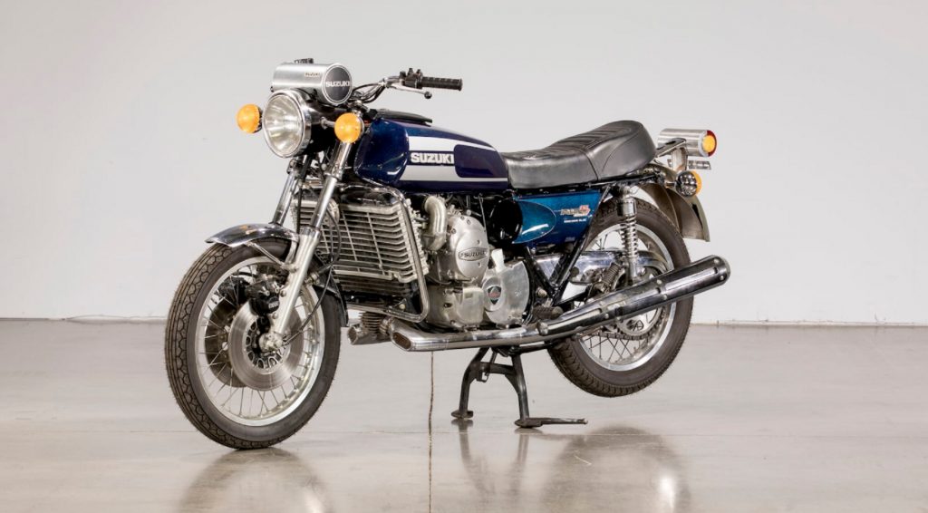 The front 3/4 view of a blue 1975 Suzuki RE5