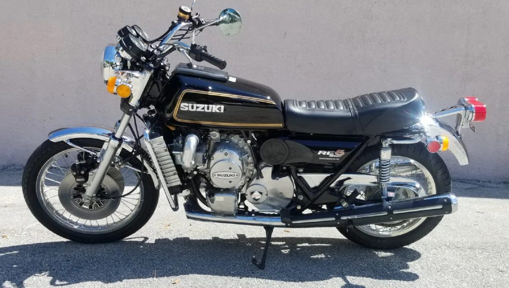 The side view of a black 1976 Suzuki RE5