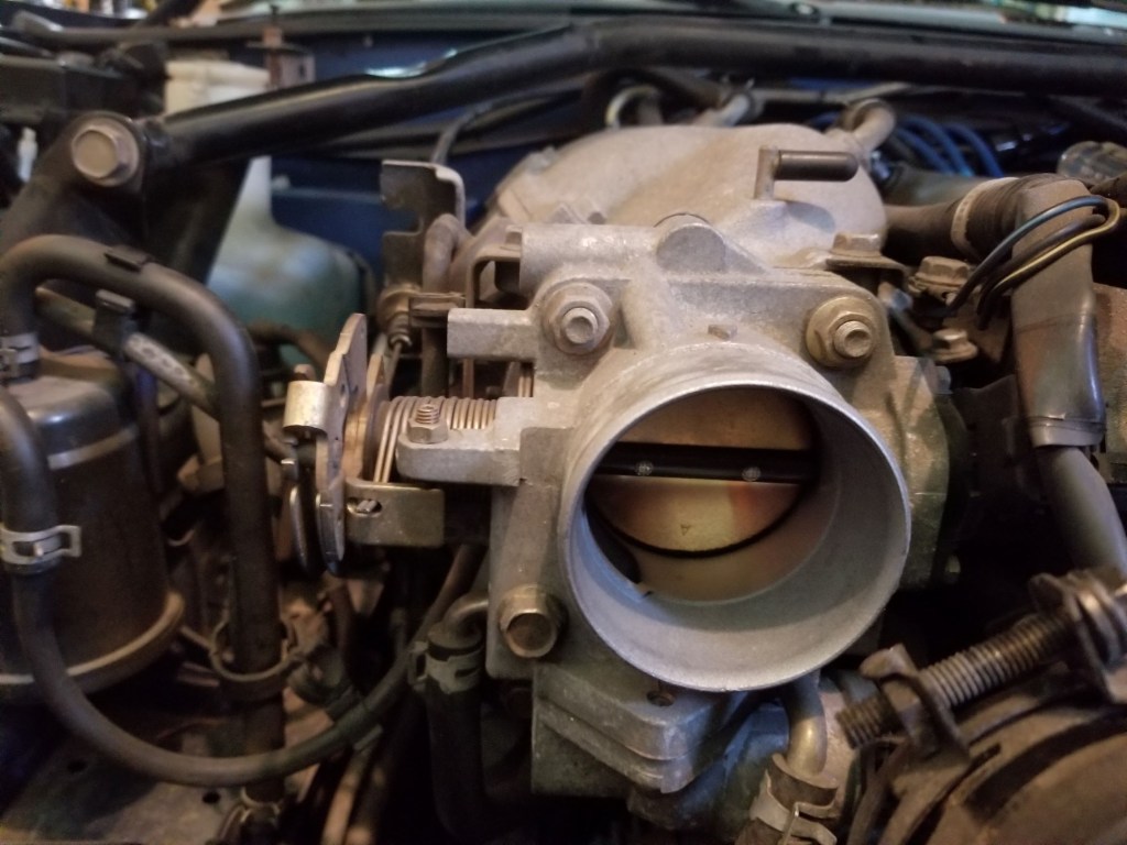 A 1999 Mazda MX-5 Miata's throttle body