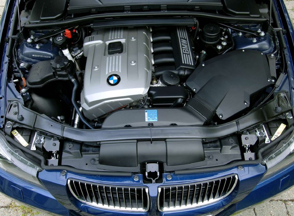 The N52 engine in the bay of a blue 2006 E90 BMW 325i Touring