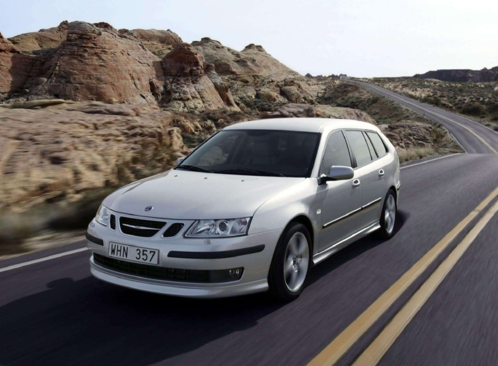 A silver 2006 Saab 9-3 SportCombi on a desert road
