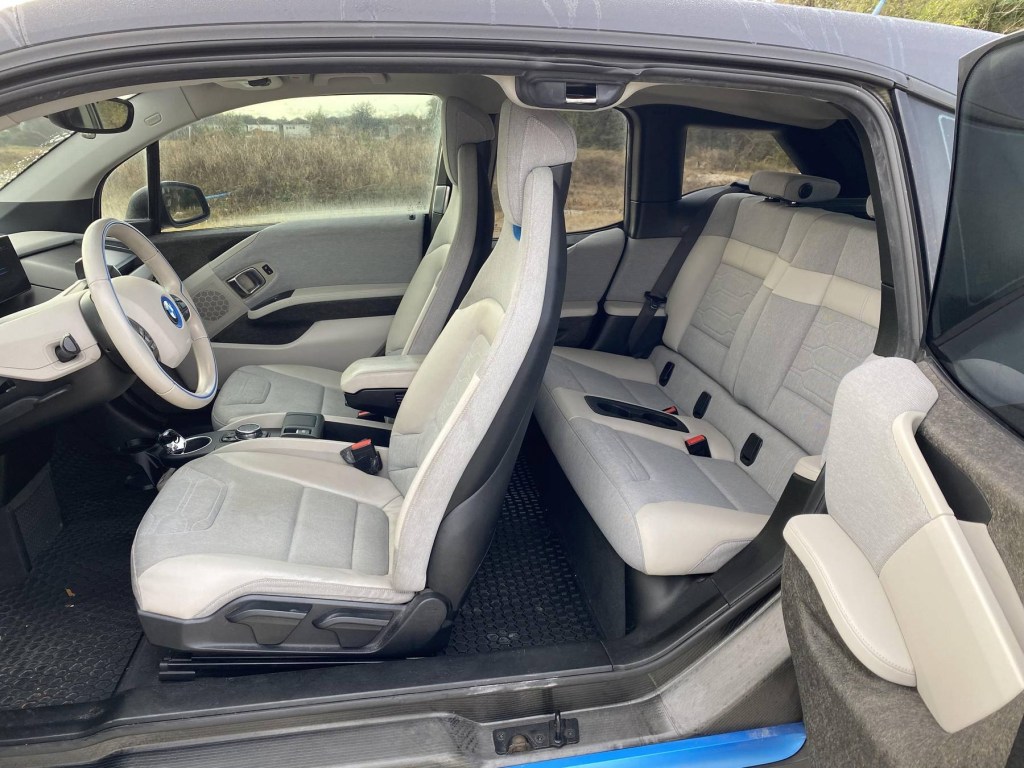 The tan-and-gray interior of a 2015 BMW i3 REX