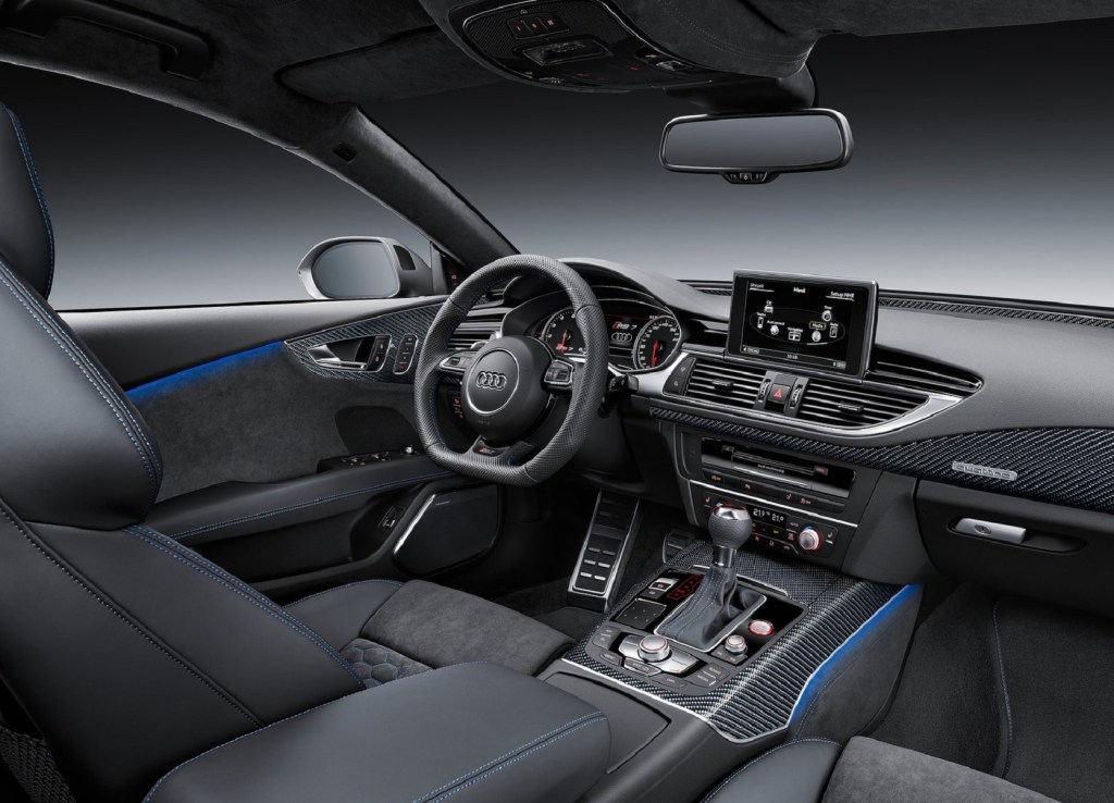The blue-stitched black front seats and carbon-fiber-trimmed dashboard of the 2016 Audi RS7 Performance