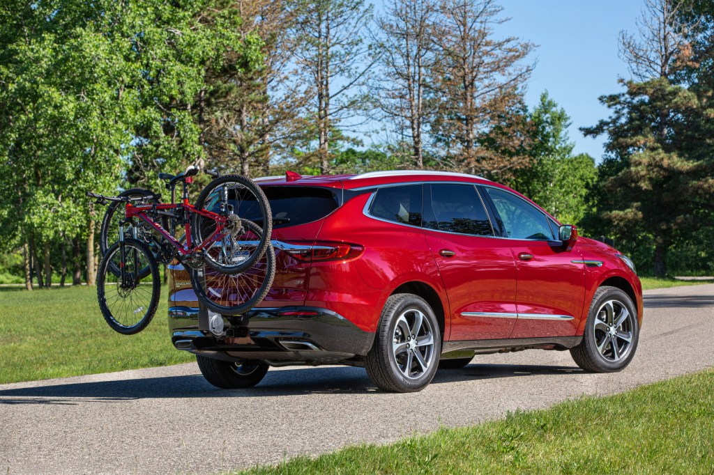 A red 2020 Buick Enclave with a bike attatched to the rear hatch