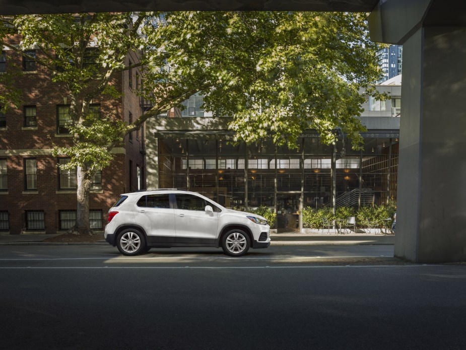 A white 2020 Chevrolet Trax subcompact SUV parked next to a building. It., too, is discontinued for 2023. 