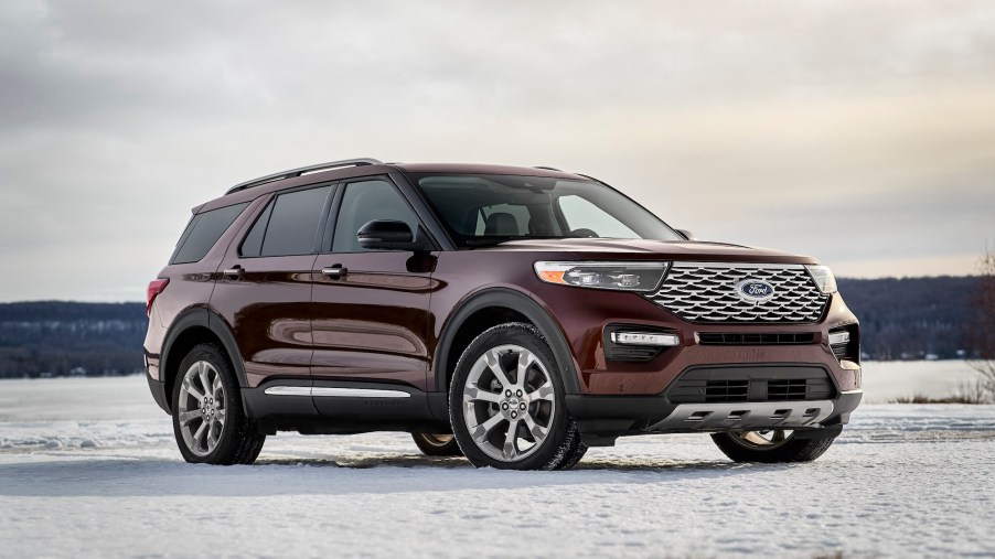 A maroon 2020 Ford Explorer Platinum parked on snow