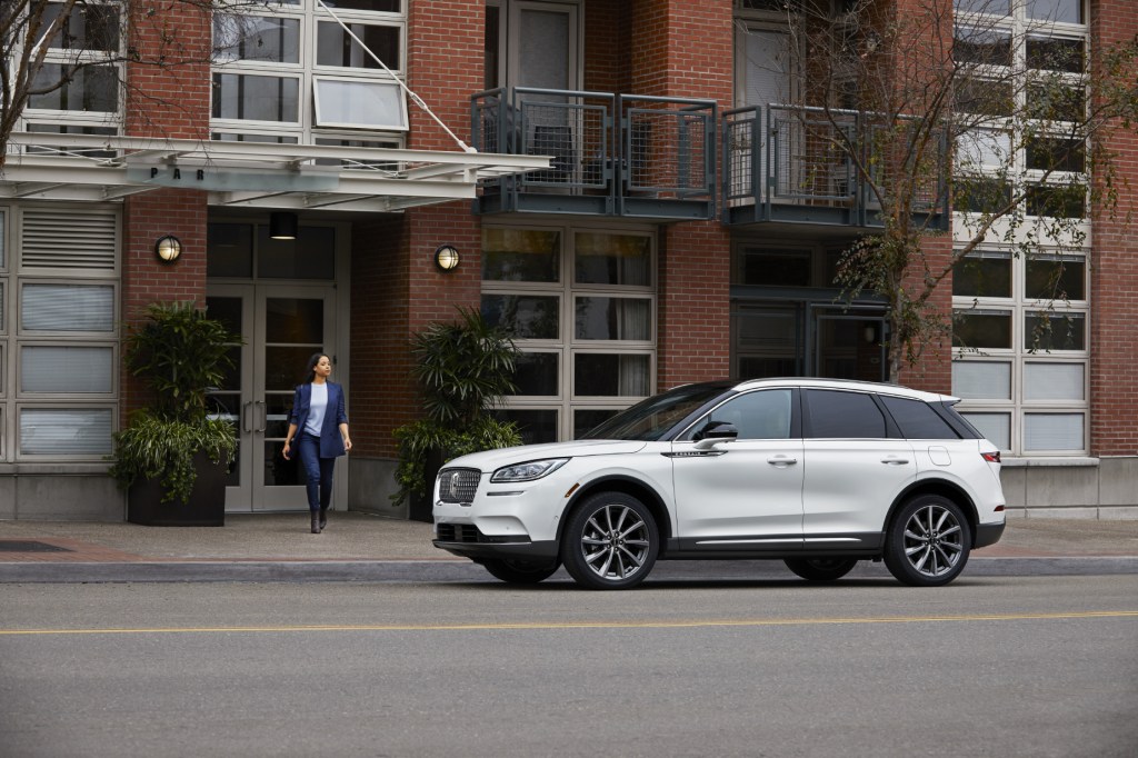 A white 2020 Lincoln Corsair parked next to a building