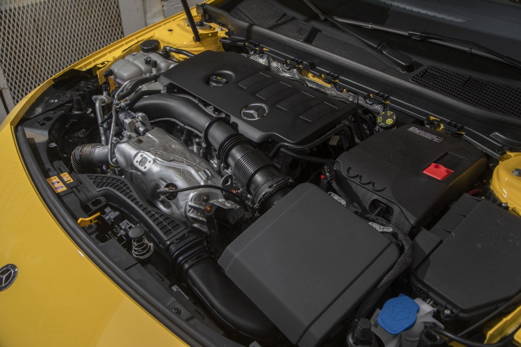 A look at the engine under the hood of a yellow 2020 Mercedes-Benz CLA 250 4MATIC