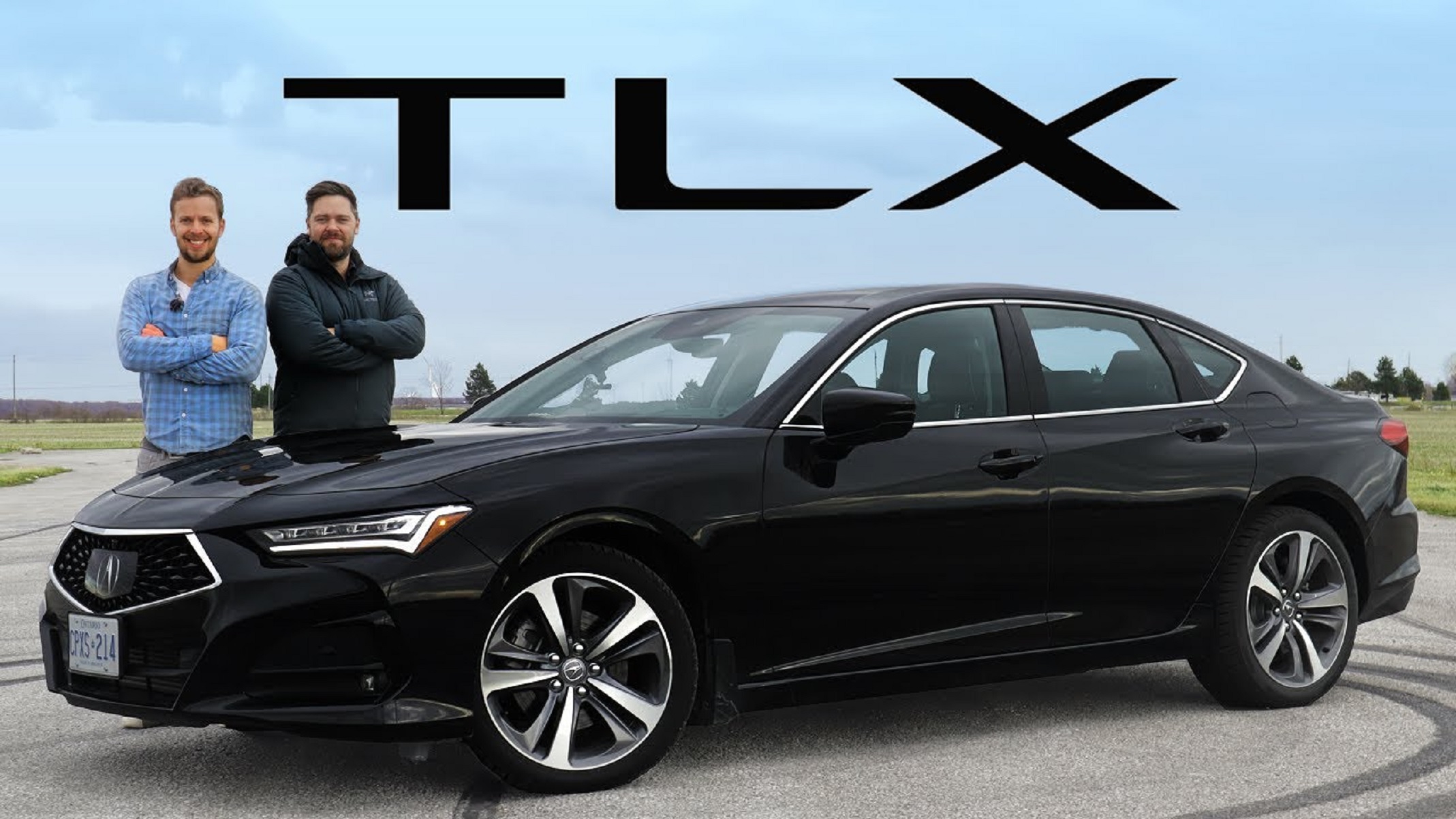 A black 2021 Acura TLX Advance Package SH-AWD on a track