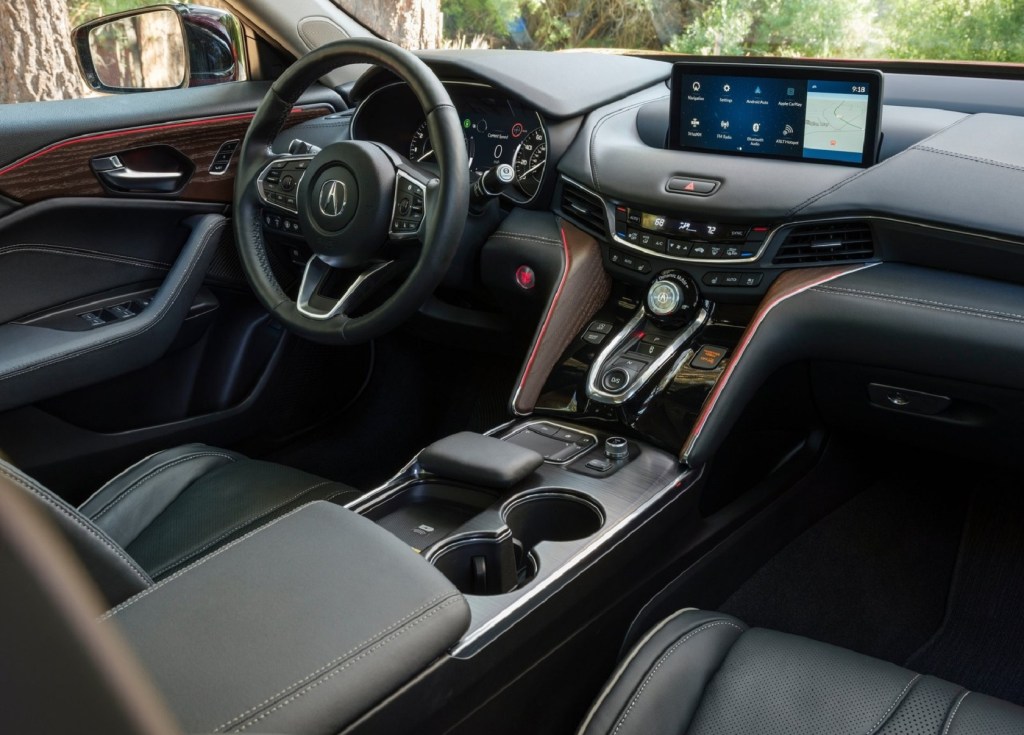 The black-leather-upholstered front seats and dashboard of the 2021 Acura TLX Advance Package