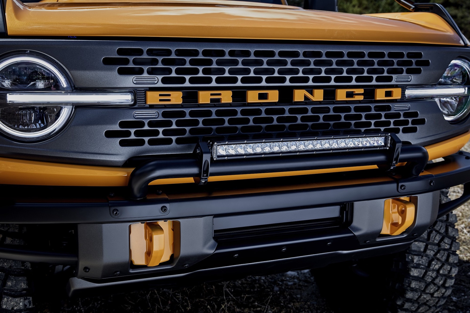 A Cyber Orange 2021 Ford Bronco's front end