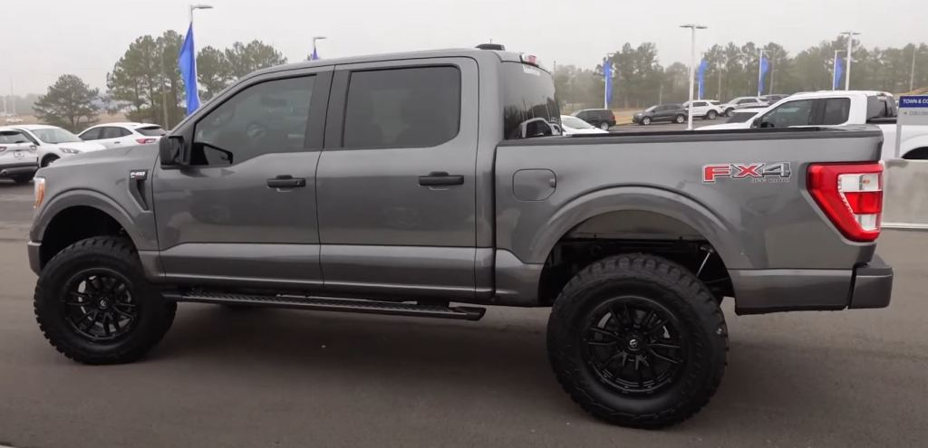 A carbon gray 2021 Ford F-150 SuperCrew with a 6-inch lift and 37-inch tires