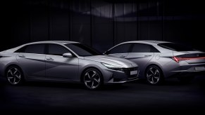 2 silver Hyundai Elantra sedans parked in the dark