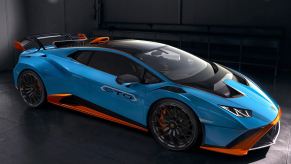 A view of the front passenger side quarter of a blue and orange 2021 Lamborghini Huracan STO.