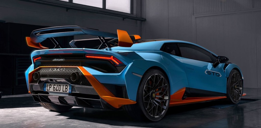 A view of the rear passenger side of a blue and orange 2021 Lamborghini Huracan STO.