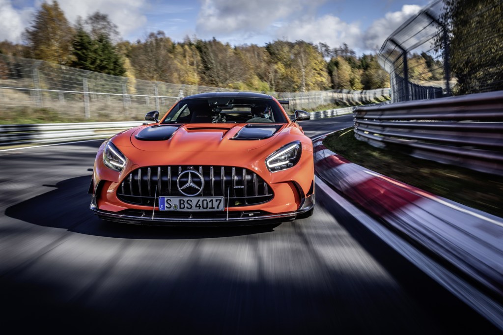 An orange 2021 Mercedes-AMG GT Black Series driving on a track