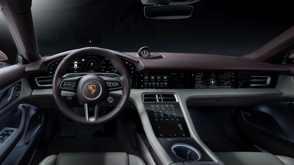 The purple-and-white front seats and dashboard of the 2021 Porsche Taycan