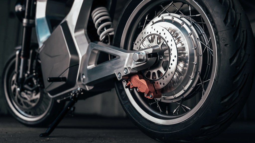 A close-up of the ByBre rear brake and electric motor on a silver 2021 Sondors Metacycle