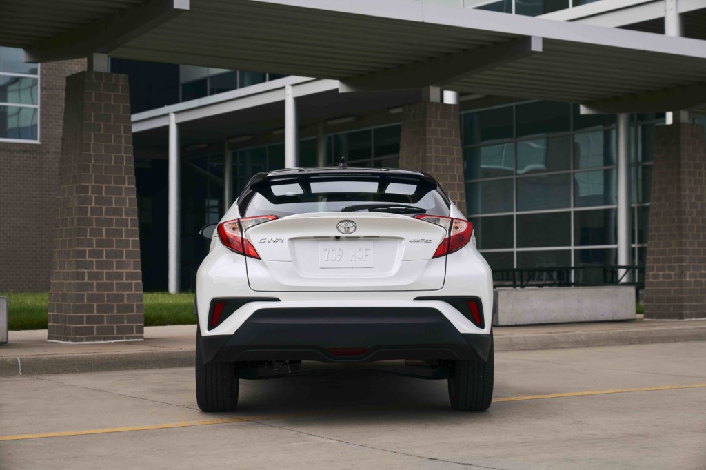 A look at the back end of a white 2021 Toyota C-HR