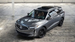 The front 3/4 overhead view of a gray 2022 Acura MDX Advance