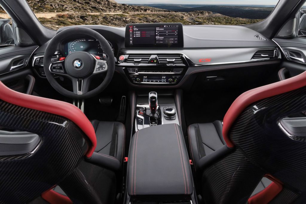 The carbon-fiber front seats and carbon-fiber-trimmed dashboard of the 2022 BMW M5 CS