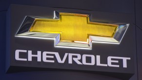 A close-up of Chevy's bowtie logo with a black background
