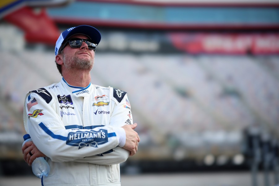 Dale Earnhardt Jr. looks to the sky with his arms folded