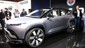 The driver's side front quarter of a silver Fisker Ocean electric SUV