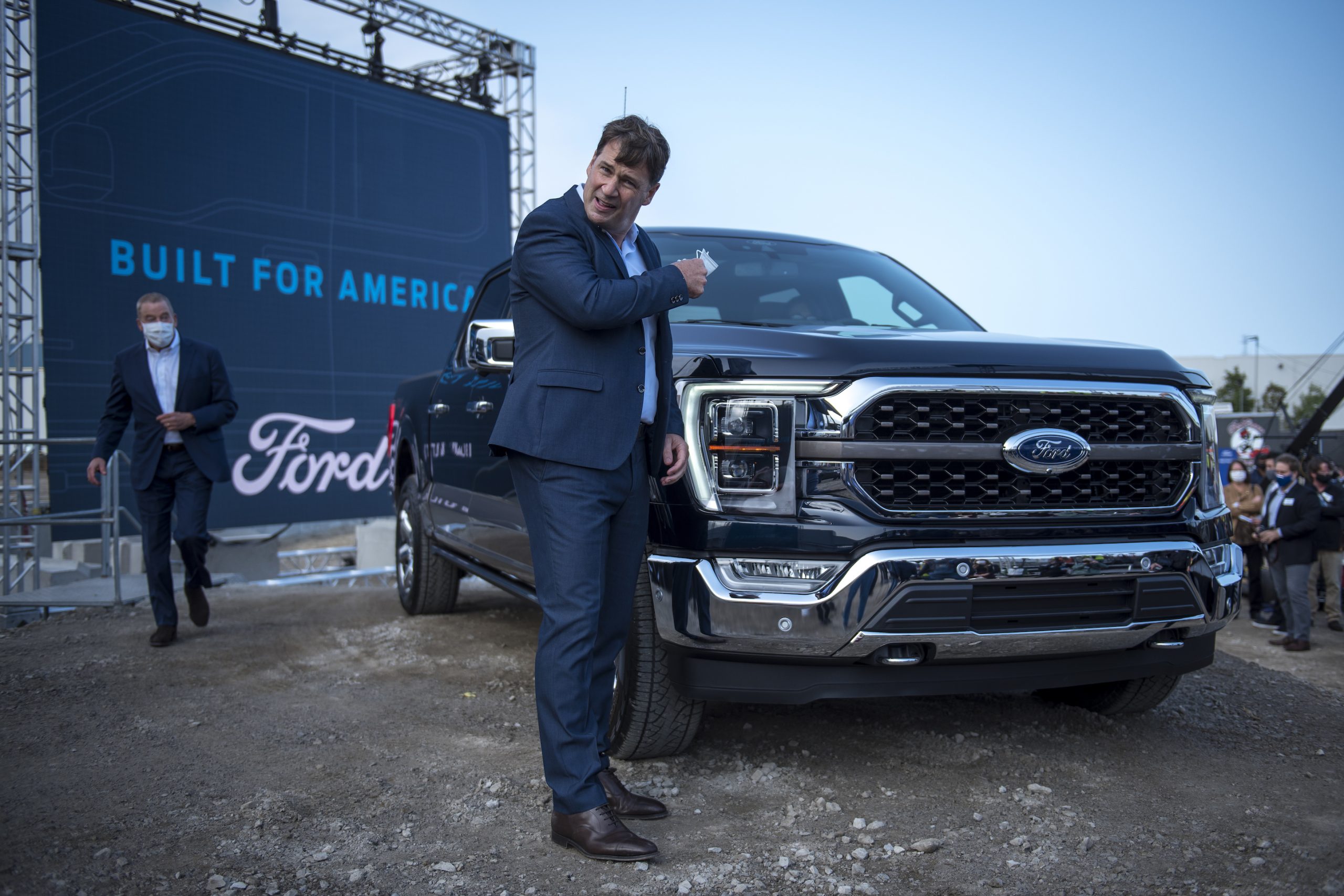 Ford CEO Jim Farley takes off his mask at the Ford Built for America event at Ford’s Dearborn Truck Plant on September 17, 2020 in Dearborn, Michigan. Ford held the event to showcase its new advertising campaign, the start of production for the new F-150 pickup truck and the future of the Dearborn Truck Plant