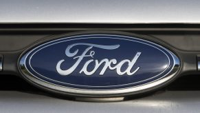 A close-up of a Ford badge on a car at the Ford garage near the Bridgend engine plant. The 2022 Ford Maverick will one day soon don the same badge