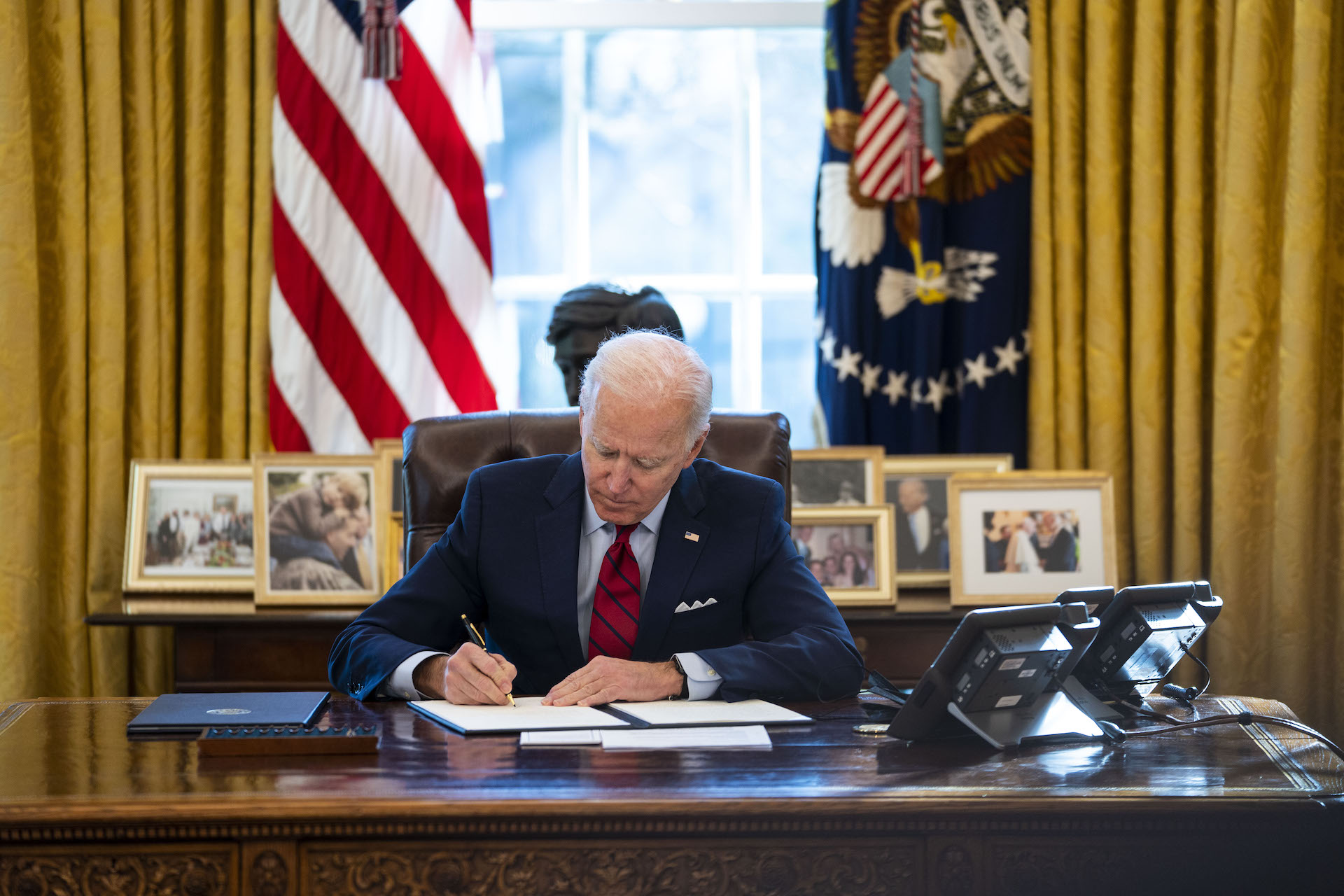 An image of President Joe Biden in the Oval Office.