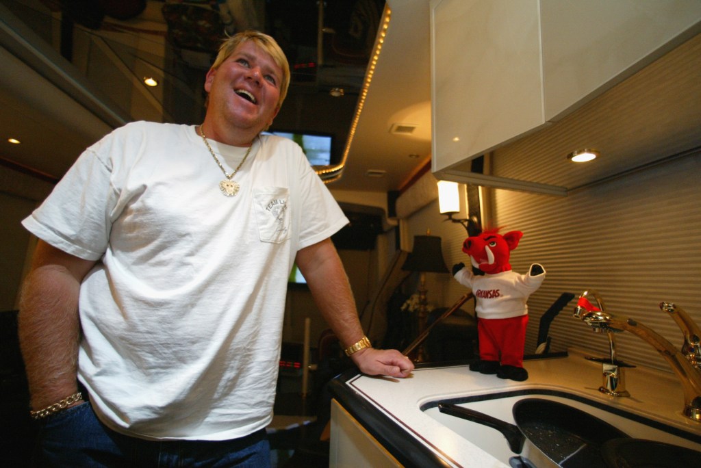 John Daly poses for a photo inside his RV