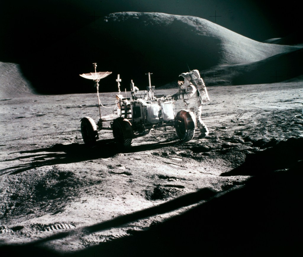 Astronaut Irwin and the Lunar Rover EV on the Moon, with Mount Hadley in the background furing the Apollo 15 mission..