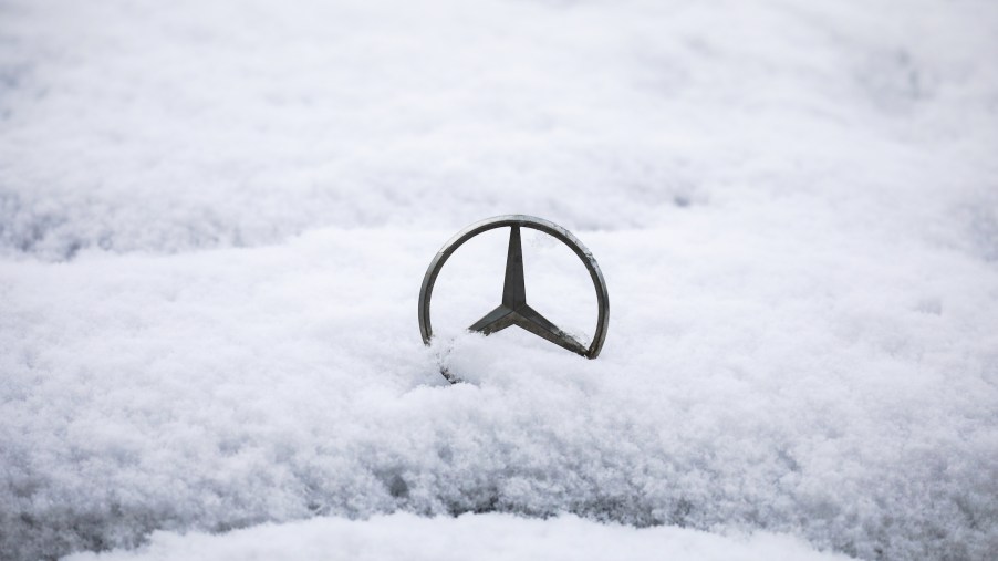 Mercedes Benz car emblem is covered with snow in Krakow, Poland